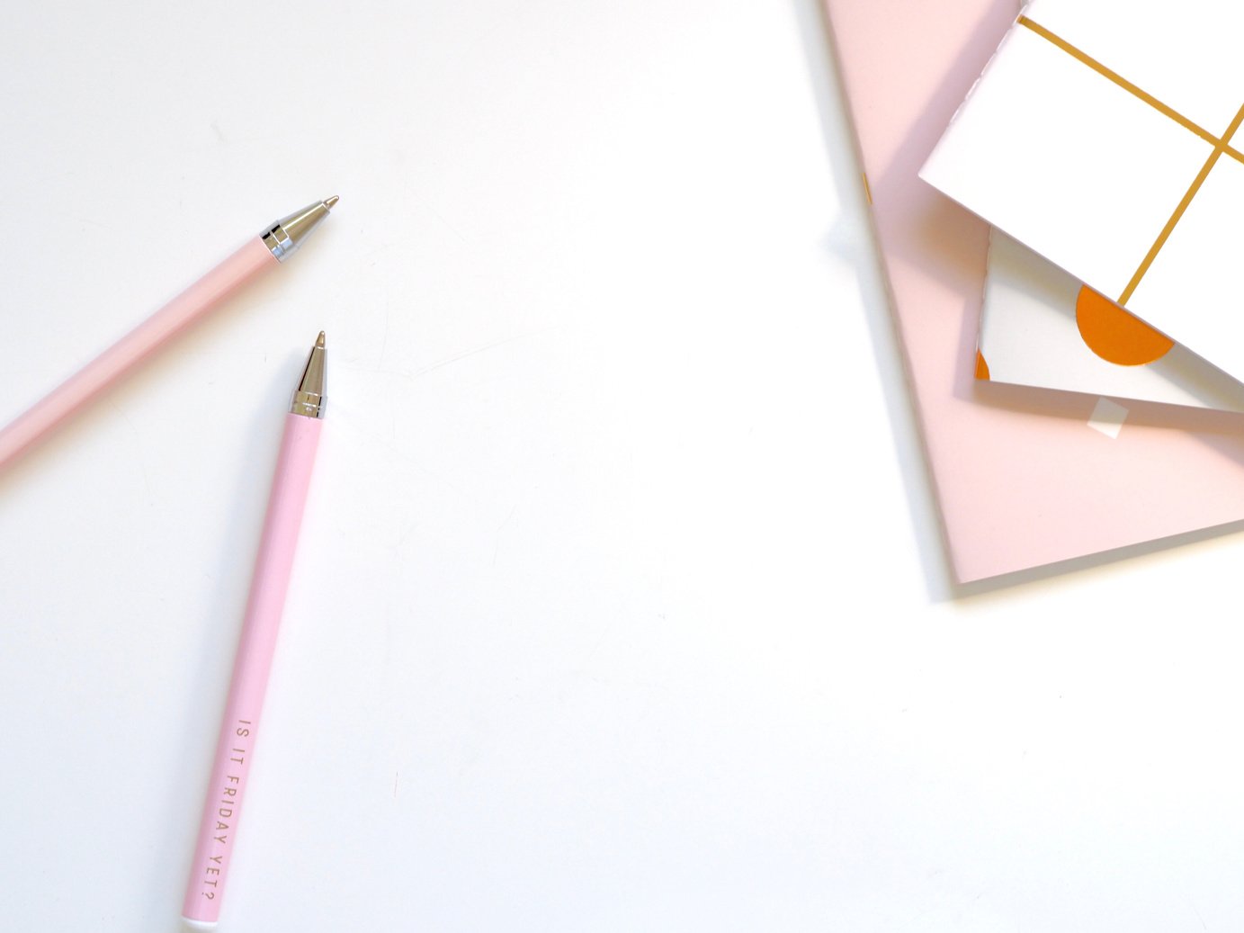 Two Pink Ballpoint Pens on Table